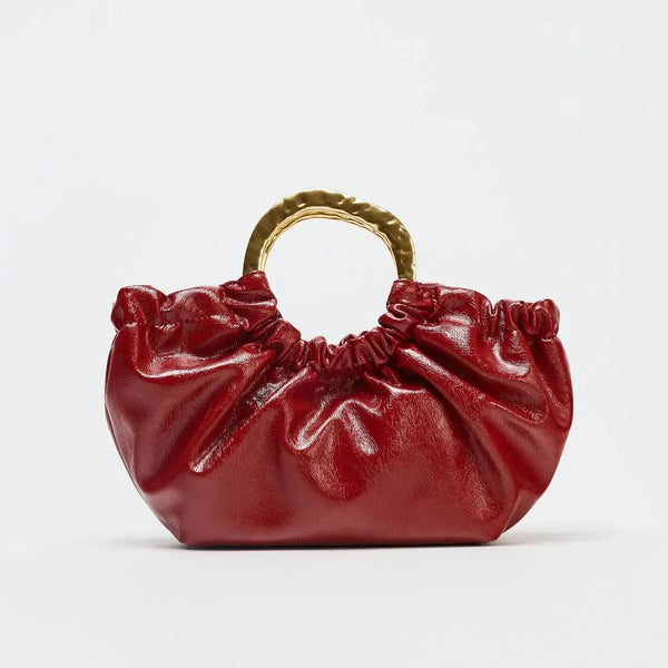 Pochette con manico in metallo in pelle sintetica